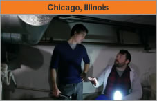Photo of two men talking. The headline over the photo reads 'Chicago, Illinois.'