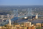 Photo of the city of Camden, with the large bridge in the foreground.