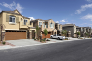 Photo of a block of homes in a suburban residential area.