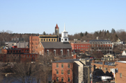Photo of a cluster of buildings in a city skyline.