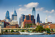 Photo of a city skyline with a variety of tall buildings.