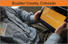 Photo of a man seated with an iPad in his lap. The headline over the photo reads 'Boulder County, Colorado.'
