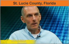 A photo of a man, head and shoulders, facing an interviewer off-camera. The headline over the photo reads 'St. Lucie County, Florida.'