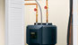 Photo of the GE GeoSpring&trade; Electric Heat Pump Water Heater fitting into a closet.