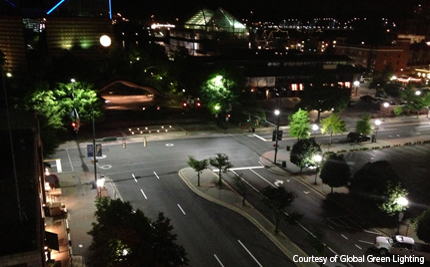 Aerial photo of a city intersection at night.