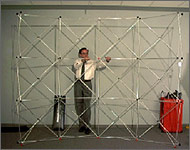 Photo of a man with an open exhibit display frame.