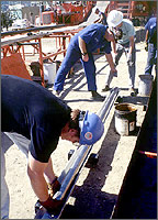 Men working at geothermal power plant.