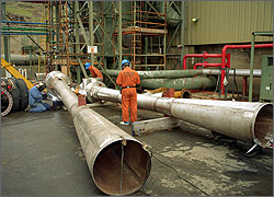 Men working at geothermal power plant.