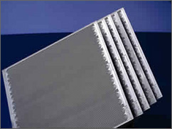 Photograph of the bipolar plates that serve as both flow field and current collectors in PEM fuel cells. The plates are made of a lightweight, strong, gas-impermeable, electron-conducting material-graphite or metals are commonly used, although composite plates are now being developed.