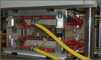 Induction molding press with seatback tool installed in the press at AjaxTOCCO, Madison Heights, Michigan.