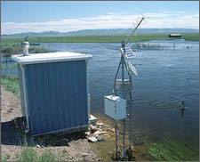 Photo of a Water-level monitoring station that uses photovoltaics for charging storage batteries.