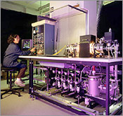 Photo of an NREL researcher using a close-space sublimation system.