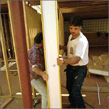 Photo of a worker installing an energy-efficient foam-core center wall section.