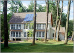 Photo of home with PV panels installed on the roof.