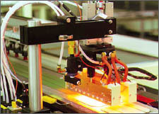 Photo of the SPI-Assembler 5000 and the SPI-Buffer 350, automated equipment used in manufacturing PV modules.