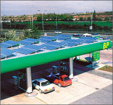 Photo of a petrol station in Perivale, United Kingdom with grid-connected, roof-mounted photovoltaic modules.