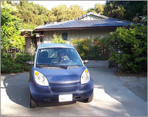 Photo of an electric vehicle in the driveway of a solar electric home in Palo Alto, California.