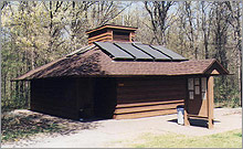 Photo of a flat-plate PV powered pump, collector and hot water installed at a campground.