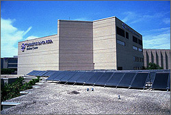 Photo of a building with the sign for Santa Rosa Hospital Northwest and solar panels.