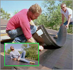 Photo of PV shingles being installed on a roof.