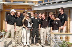 Photo of the University of Colorado student design team celebrates winning the first Solar Decathlon.
