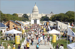 Photo of thousands of visitors descending upon the Washington Mall to tour the village of the Solar Decathlon.