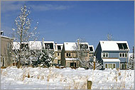 Photo of homes with solar heating installed on the roofs.
