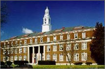 Photo of the historic Woodrow Wilson High School building with a blue sky visible in the background.