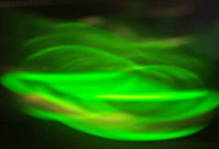 Image showing light that appears green and yellow representing plasmonic control of sub-bandgap photons.