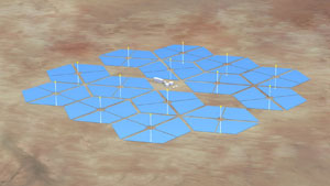 Photo of a brown plot of land with small buildings in the center, surrounded by hexagon spaces drawn on top.