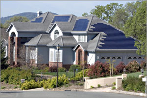Photo of houses with solar panels on the roof.