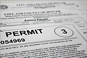 Close-up photo of a sheet of paper with PERMIT in the center.