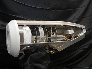 Photo of cylinder-shaped device with a wider, white base that slims to a metallic tip.