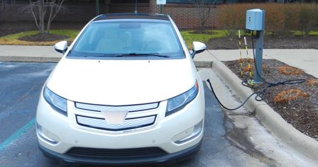 White Chevy at an AVL charging station.