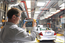 Engineer uses a thermal camera to check temperatures during "hot" testing. The Advanced Powertrain Research Facility's Environmental Test Cell is equipped to evaluate vehicles and components under extreme hot and cold temperature conditions (from 20°F to 95°F).