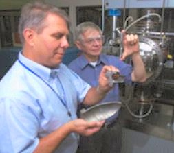 Scientists at Oak Ridge National Laboratory (ORNL) display components made from the R&D 100 Award-winning New Cast Stainless Steel for High-Temperature Performance, or CF8C-Plus, which was developed jointly by ORNL and Caterpillar.