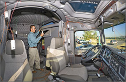 Photo of NREL Senior Project Leader Ken Proc examining sensors.