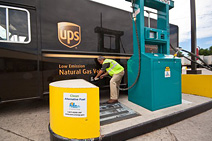 Photo of a man fueling a natural gas UPS truck.
