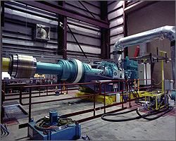 Photo of a large drivetrain spinning on a dynamometer test bed.