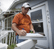 Photo of a home energy upgrade professional