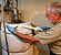 Photograph of a volunteer insulating a water heater