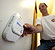 Photo of a homeowner adjusting the settings on a carbon monoxide detector.