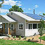 Photo of a house with solar panels.