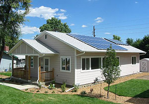 Photo of a house with solar panels.